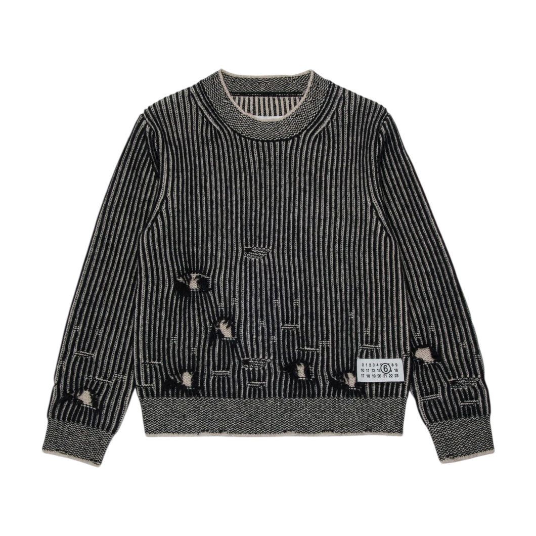 Pullover in lana a coste con rotture