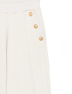 Pantaloni sportivi con bottoni oro